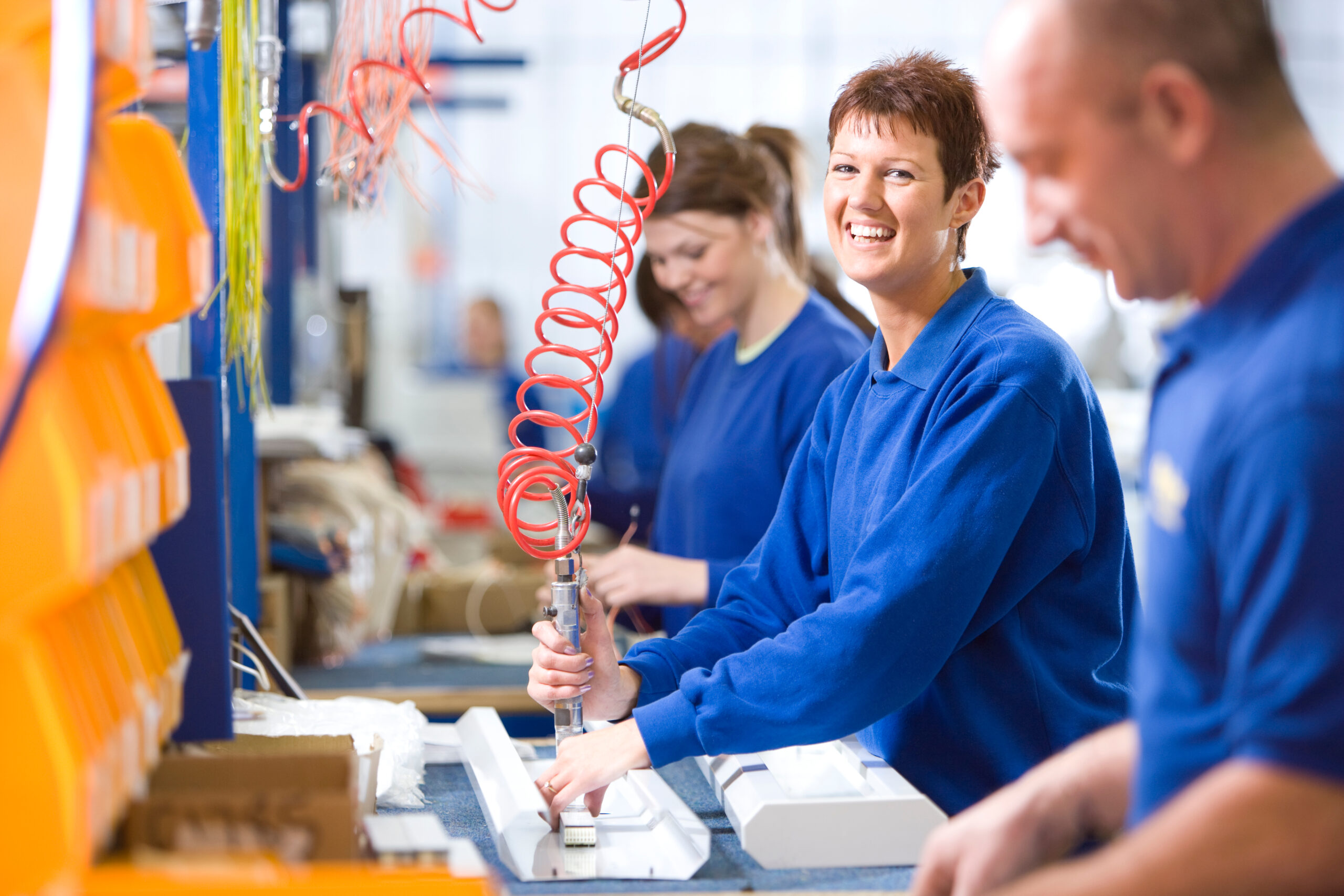 A,Medium,Shot,Of,A,Young,Female,Worker,Smiling,At